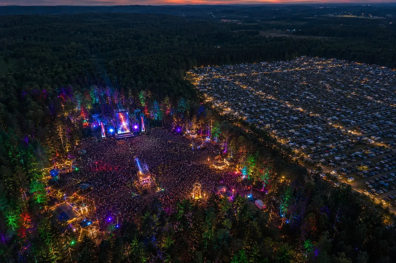Aerial view of the Lit Galaxy festival grounds glowing at dusk in Ontario